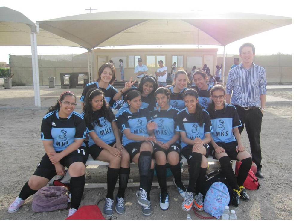 Nick with the Modern Knowledge Schools girls soccer team in Bahrain