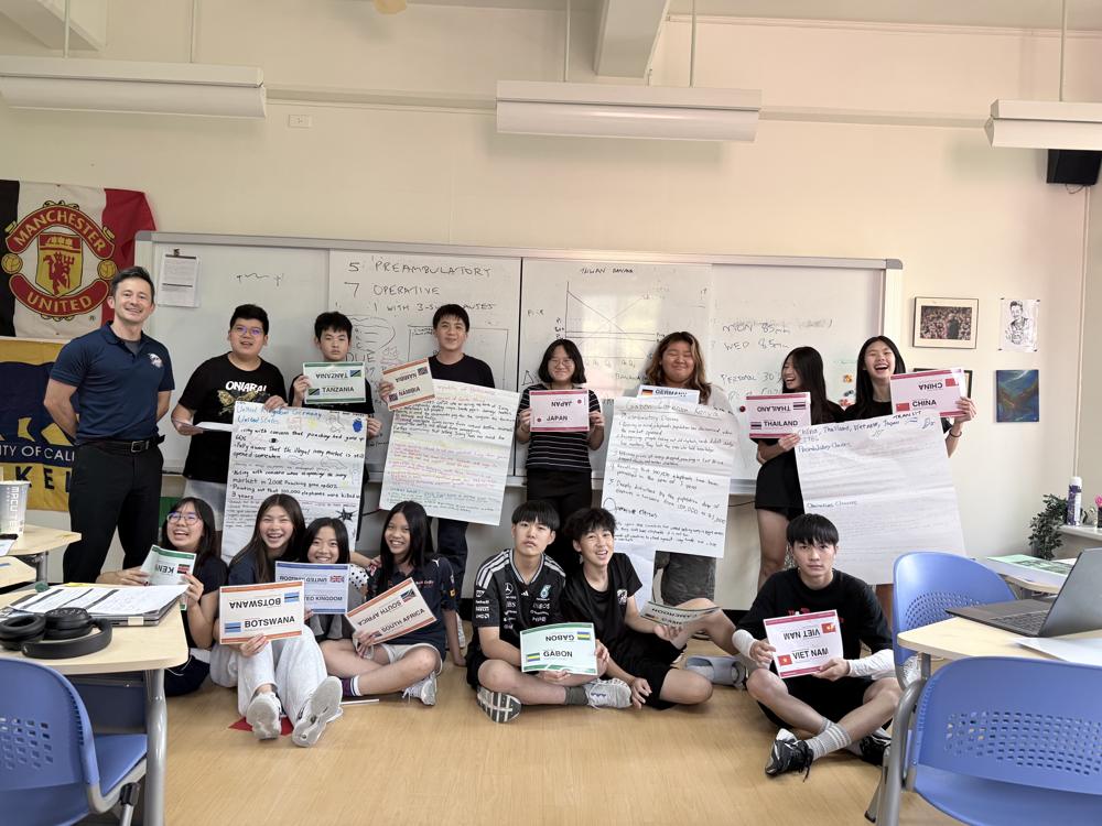 Nick with his Grade 8 MUN class and their ivory trade position papers